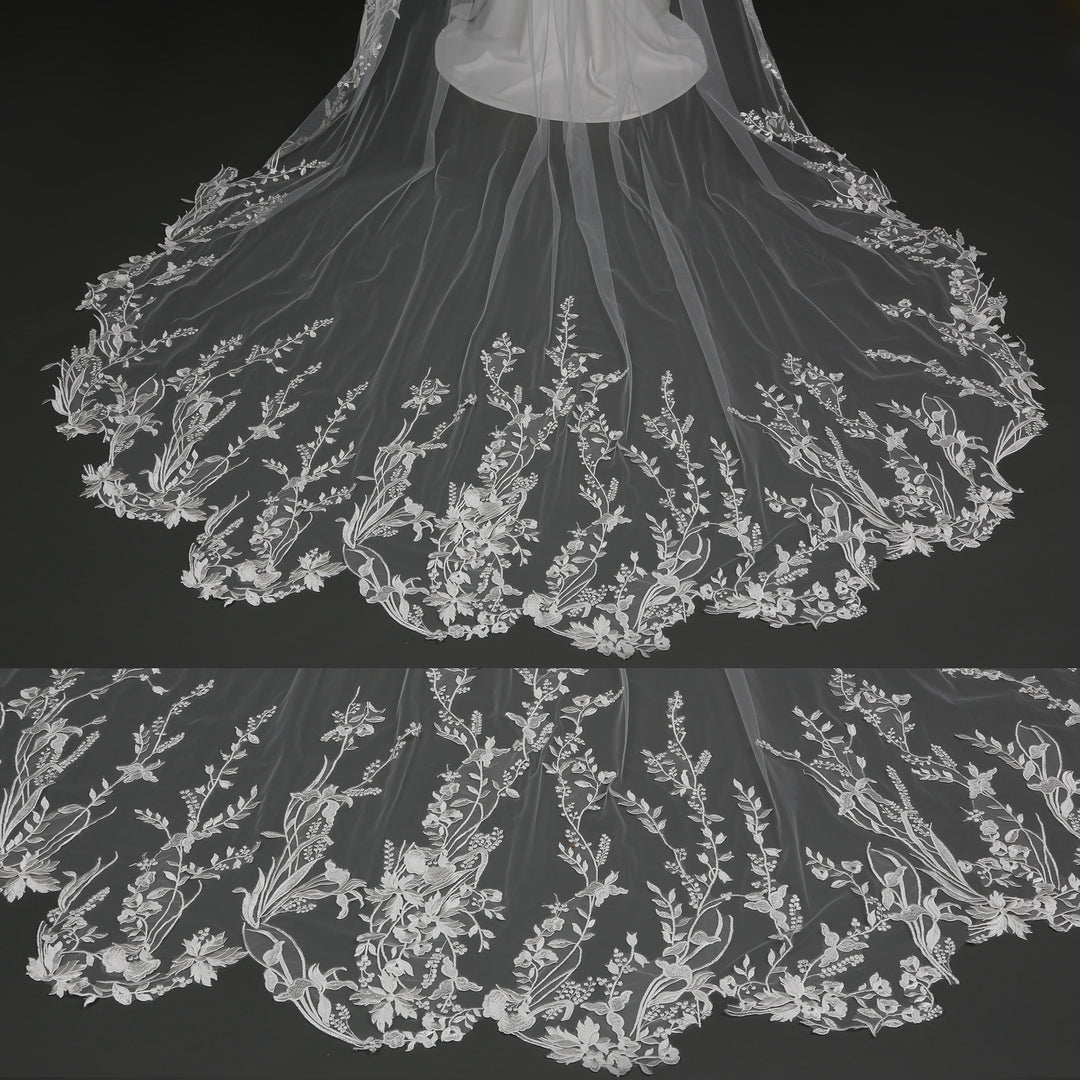 Detailed shot of rhinestone crystal embellishments on floral vine embroidered bridal veil.