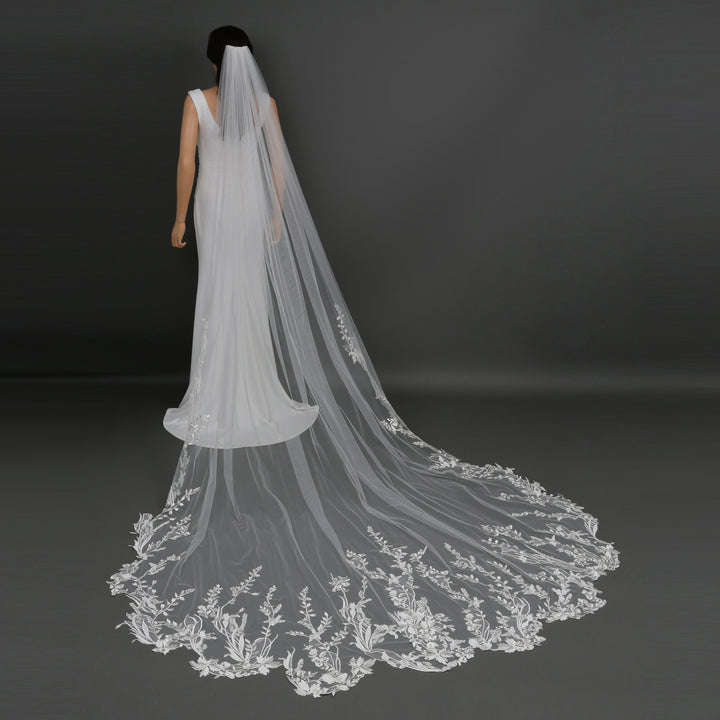 Side view of 120-inch lace bridal veil with scalloped edges, showcasing soft tulle draping in ivory.