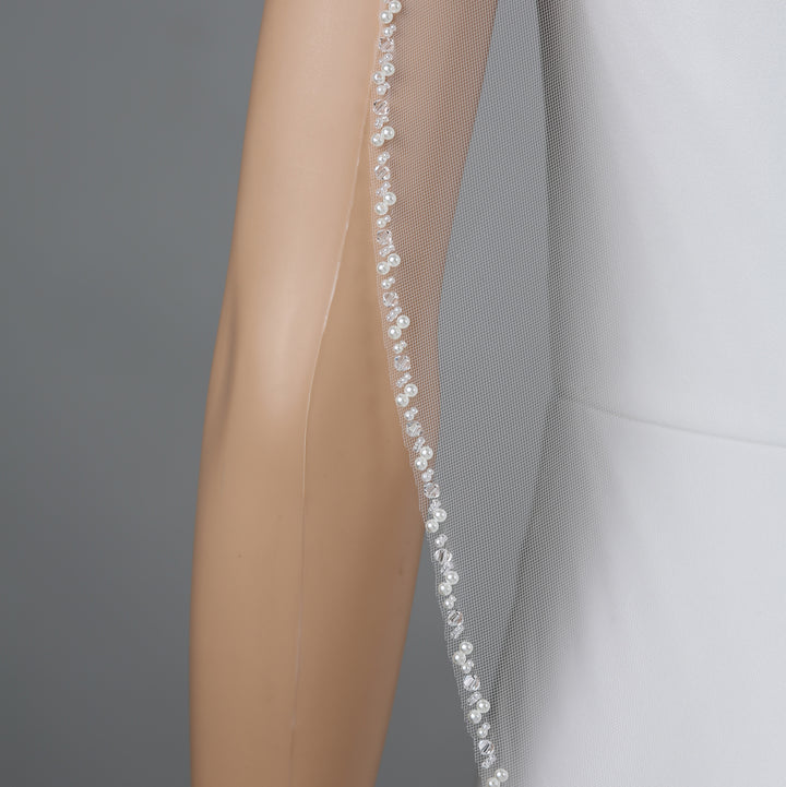 Close-up of FS6240 lace embroidery with rhinestones and pearls.