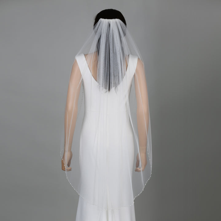 FS6241 cathedral veil styled with elegance on mannequin.