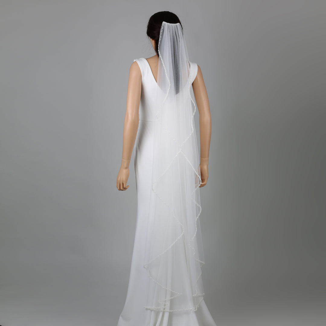 FS6243-AC bridal veil styled on mannequin, highlighting chapel-length design.