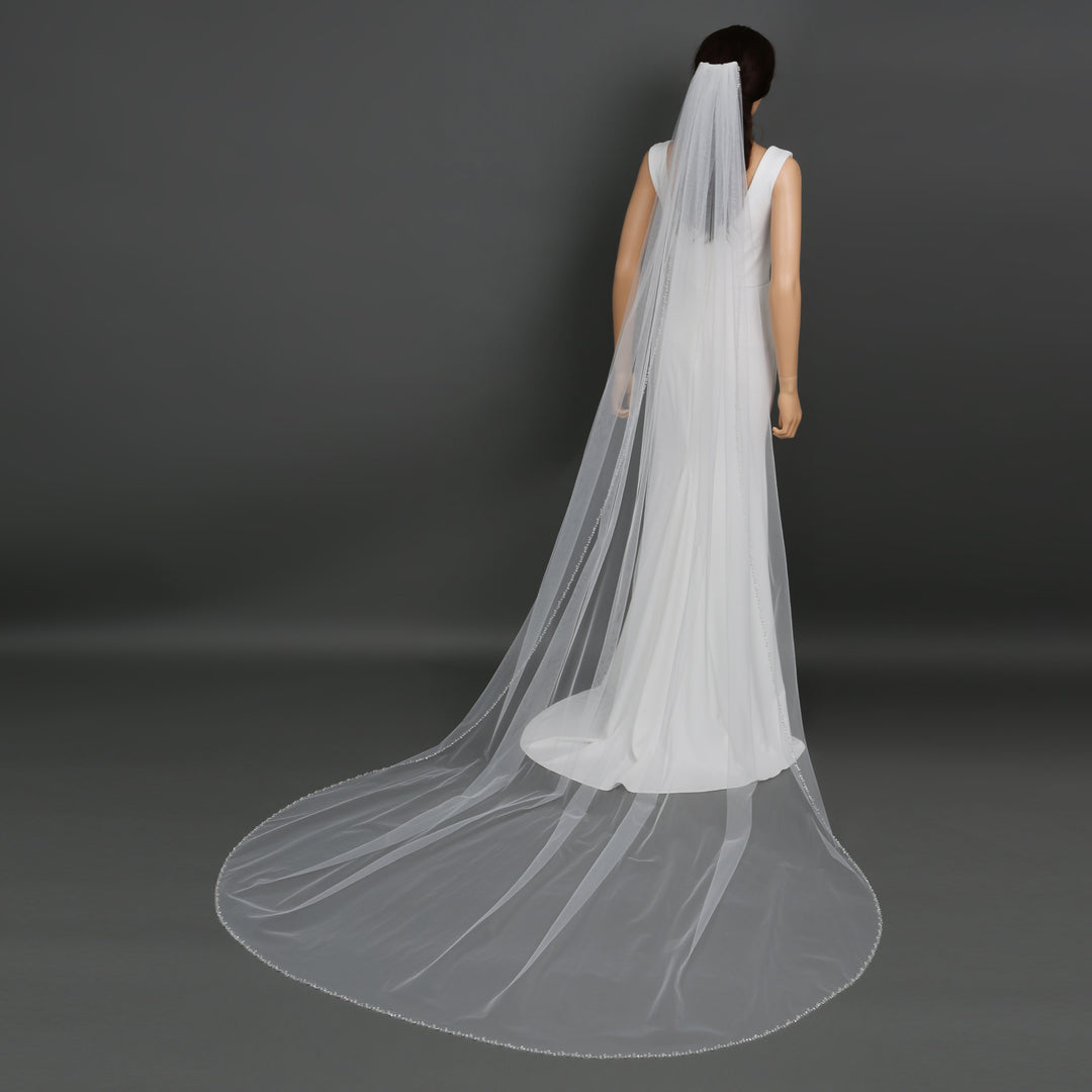 Side view of FS6249 showcasing scalloped lace edges and elegant flow.