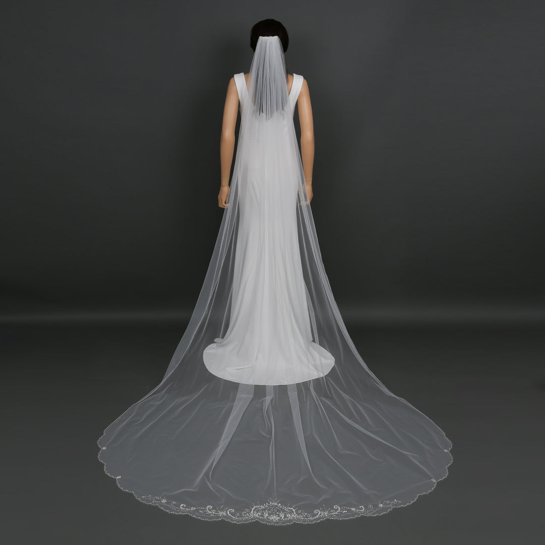 Side view of FS6252 showcasing scalloped lace edges and dramatic flow.