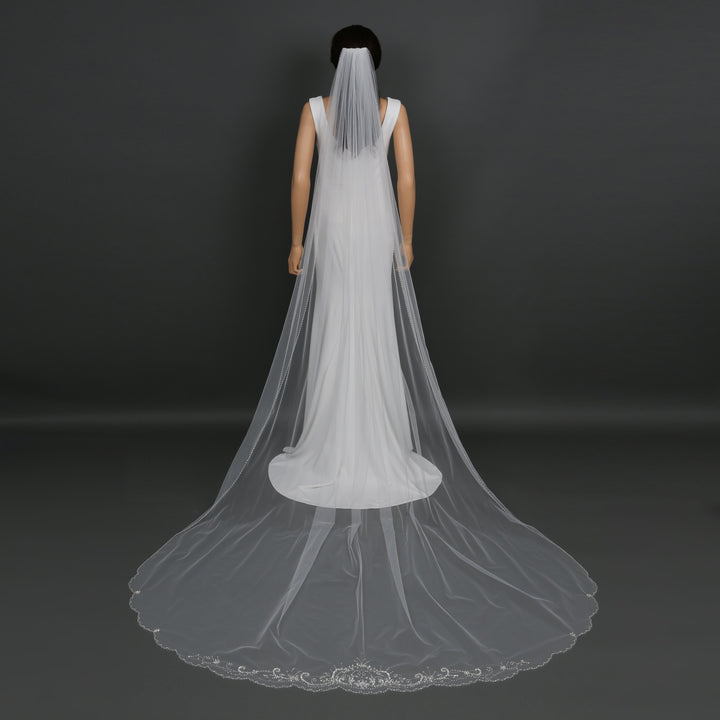 Side view of FS6252 showcasing scalloped lace edges and dramatic flow.