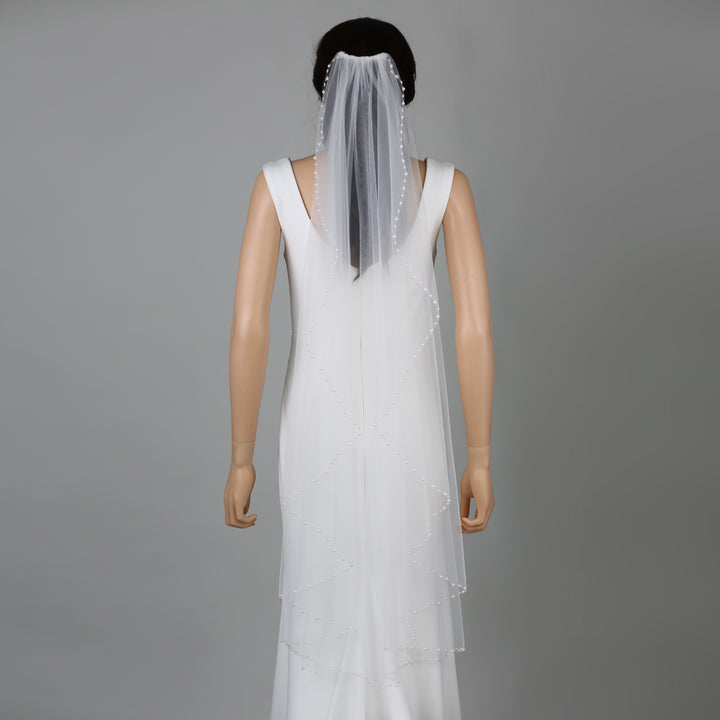 FS6259-AC bridal veil styled on mannequin, highlighting mid-length design.