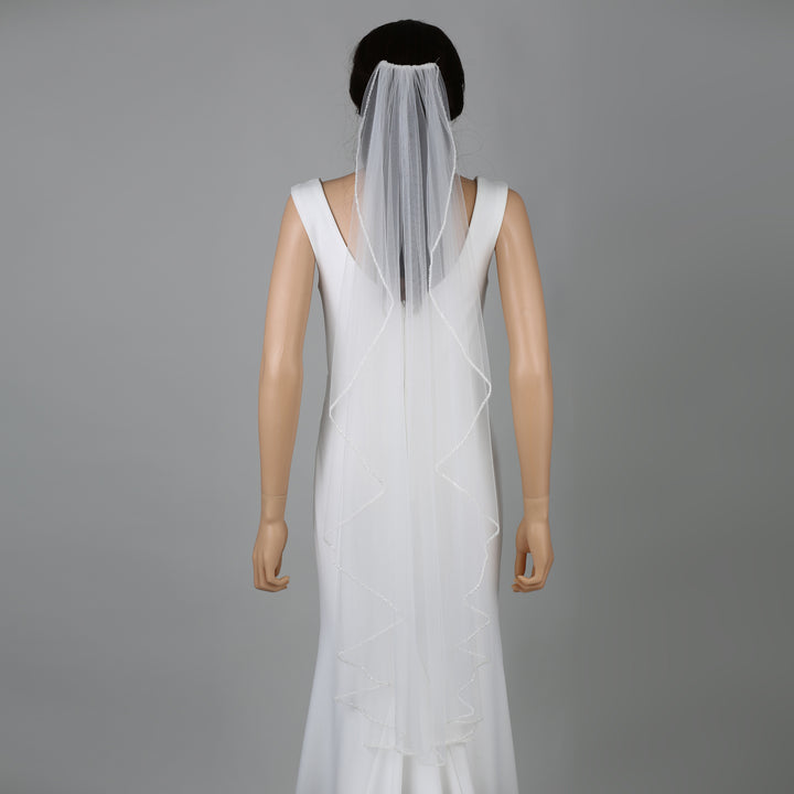 FS6262-1-AC bridal veil styled on mannequin, highlighting chapel-length flow.