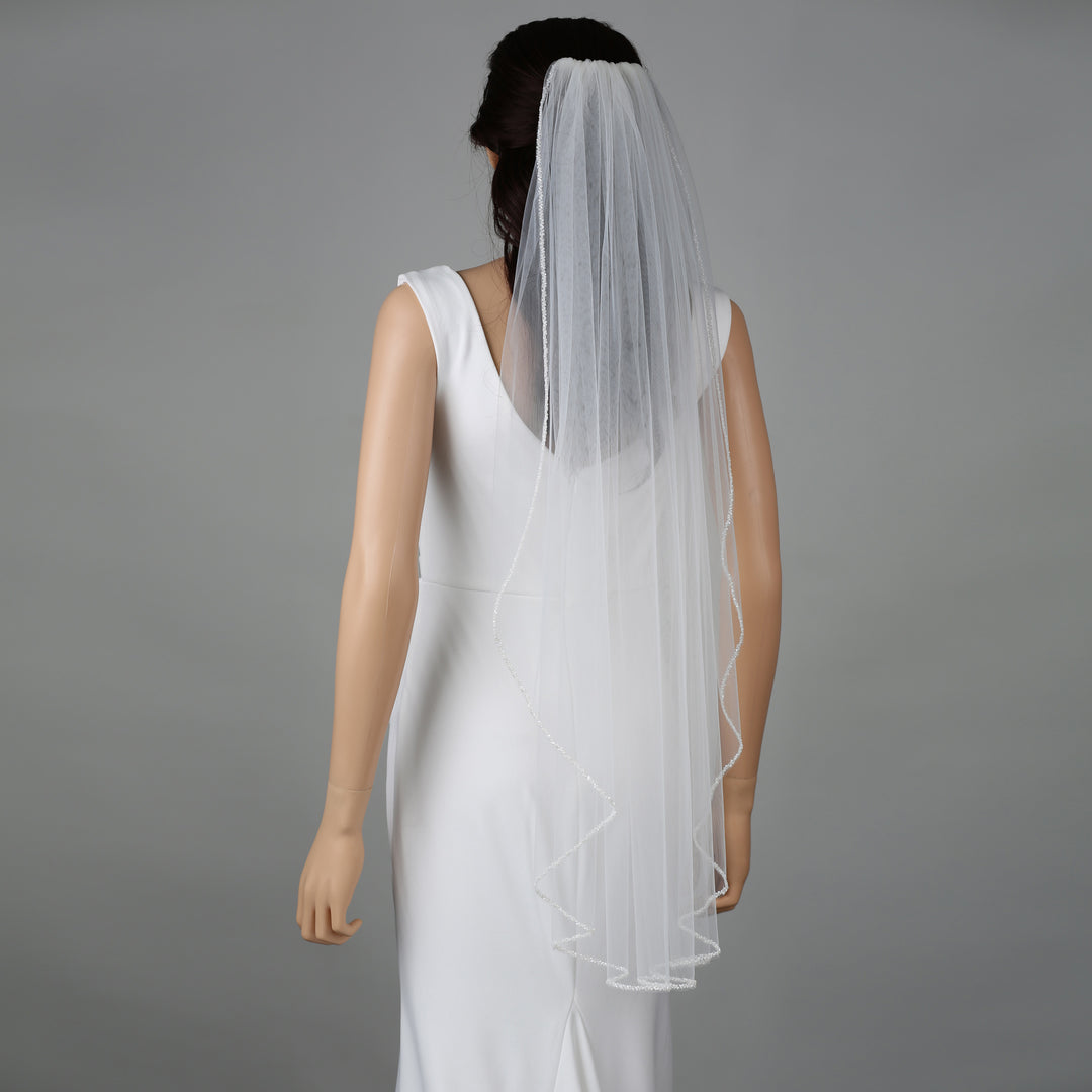 FS6262-1 bridal veil styled on mannequin, highlighting cathedral-length design.