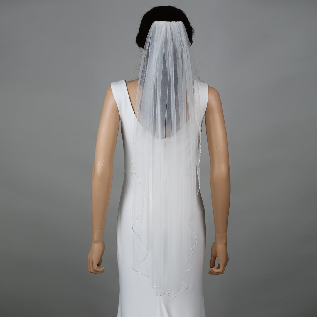 FS6269-4 bridal veil styled on mannequin, highlighting chapel-length design.