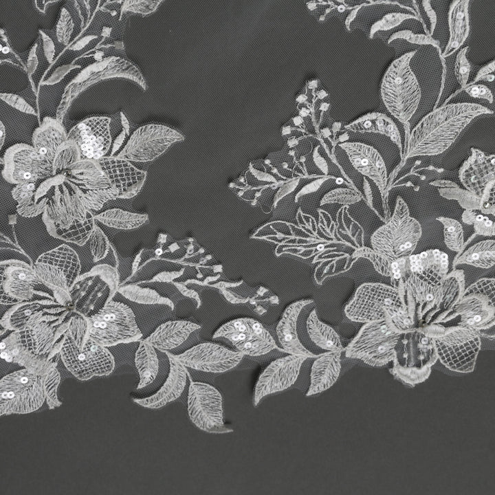 Close-up of FS6281 floral lace edges with rhinestone accents.