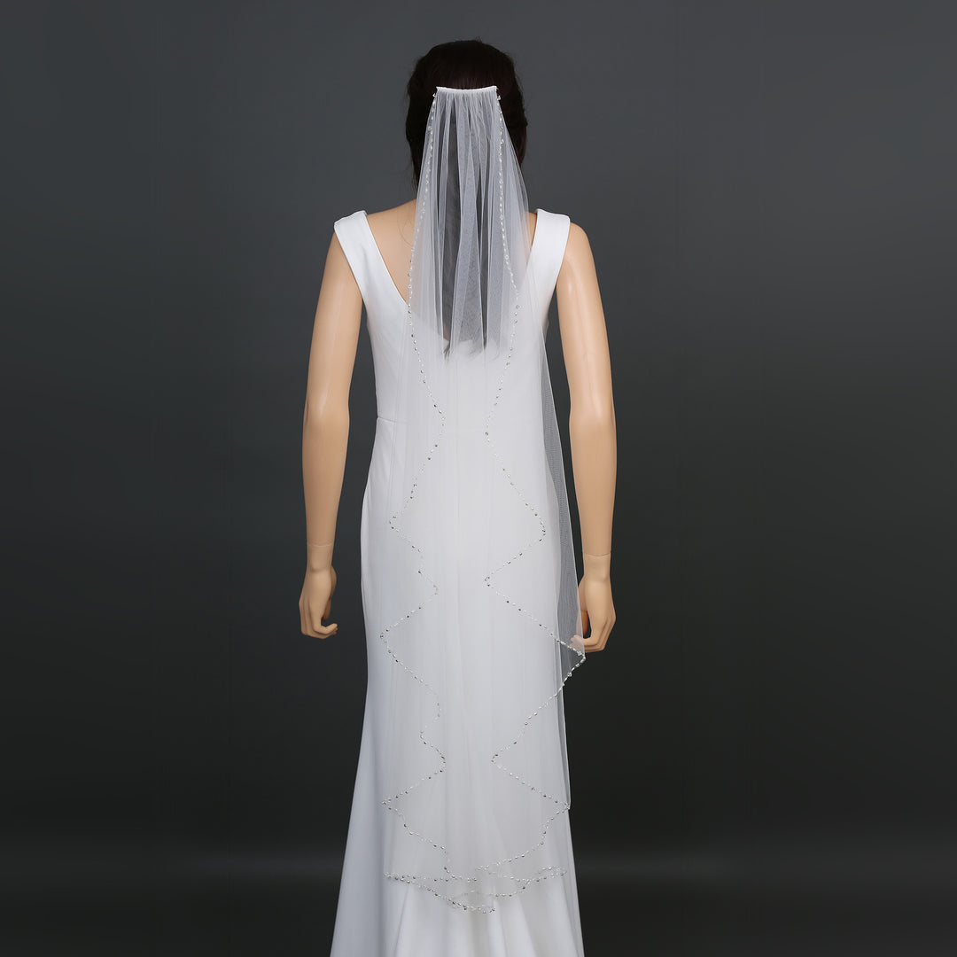 FS6284 bridal veil styled on mannequin, highlighting chapel-length design.