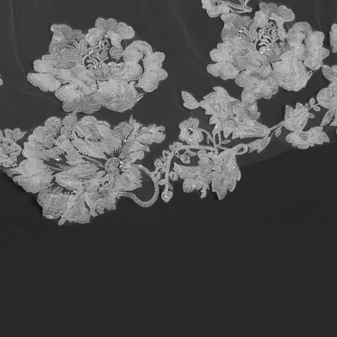 Close-up of FS6288A floral lace edges with rhinestone accents.