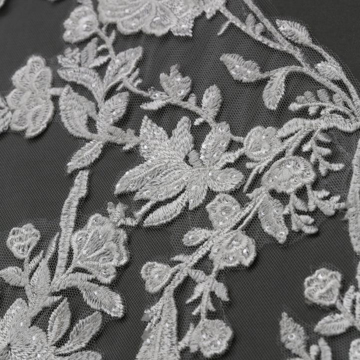 Close-up of FS6295 floral lace edges with rhinestone accents.