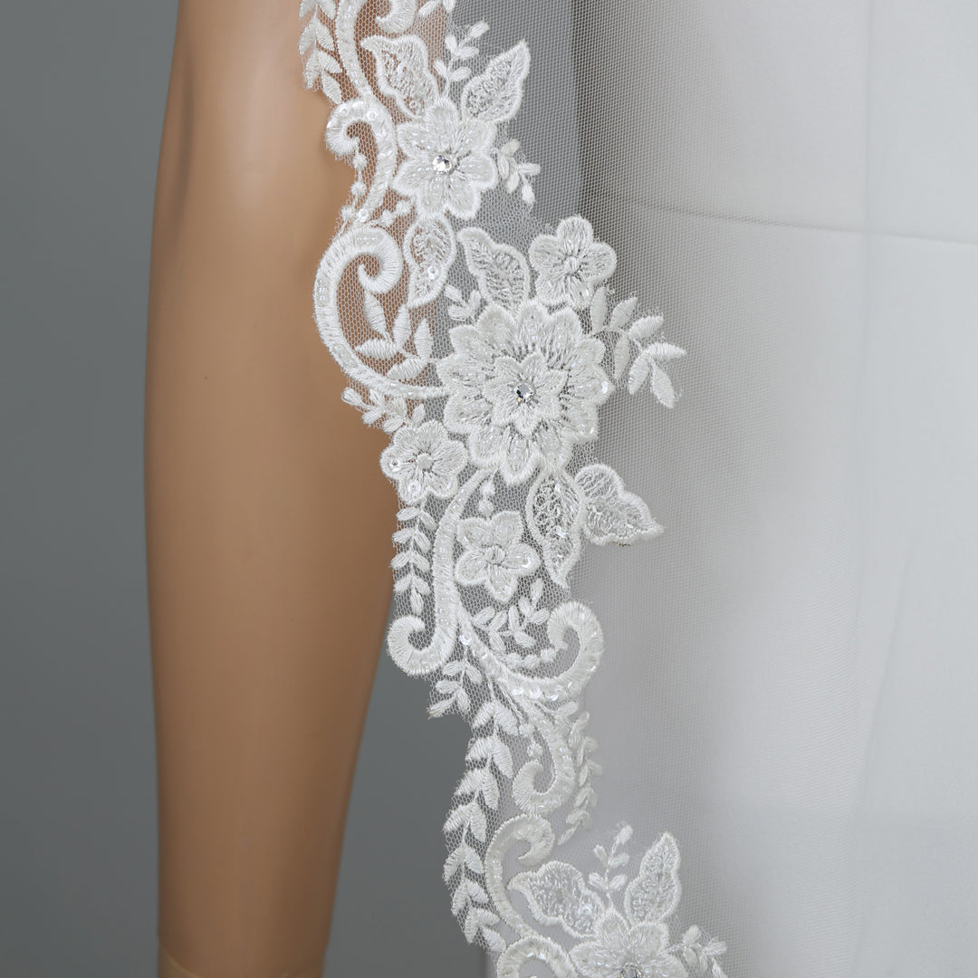 FS6301 rear view showcasing dramatic flow and intricate embroidery.