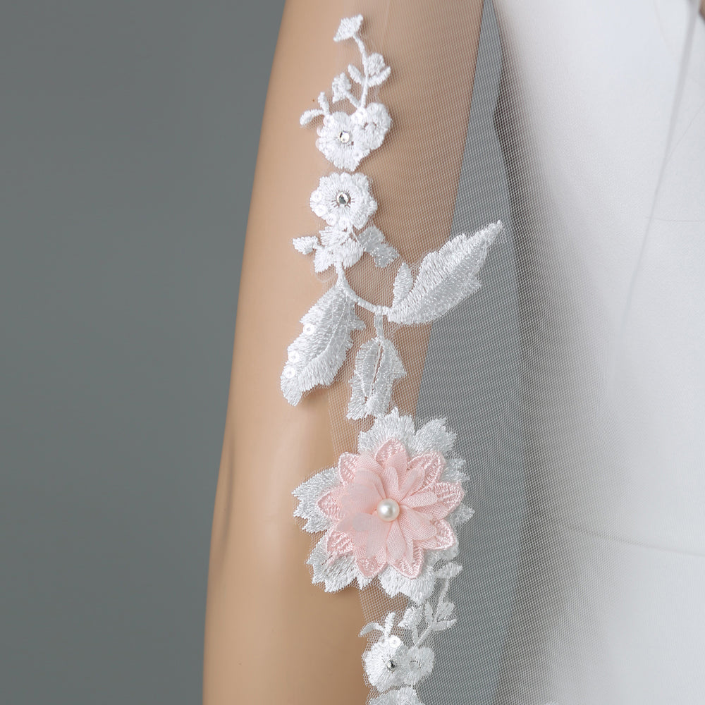 Close-up of FS6315 lace embroidery with rhinestones and pearls.