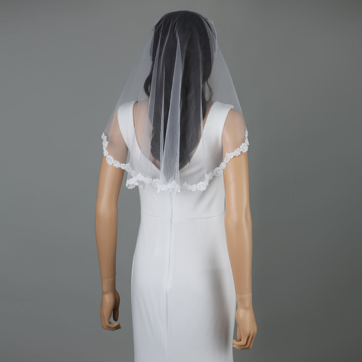 FS6316-M bridal veil styled on mannequin, highlighting mid-length design.