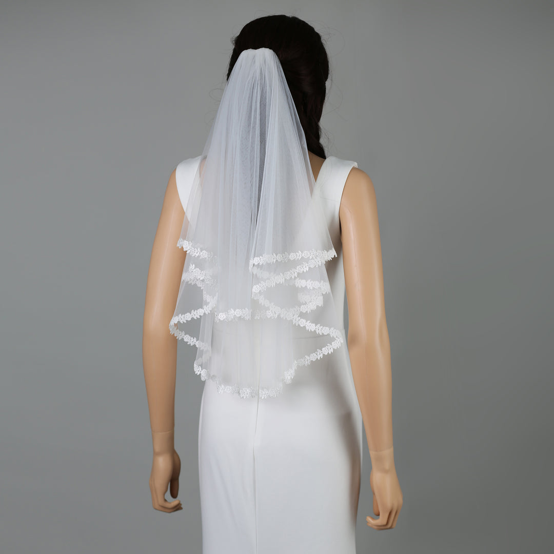 FS6318 bridal veil styled on mannequin, highlighting elegant chapel length.