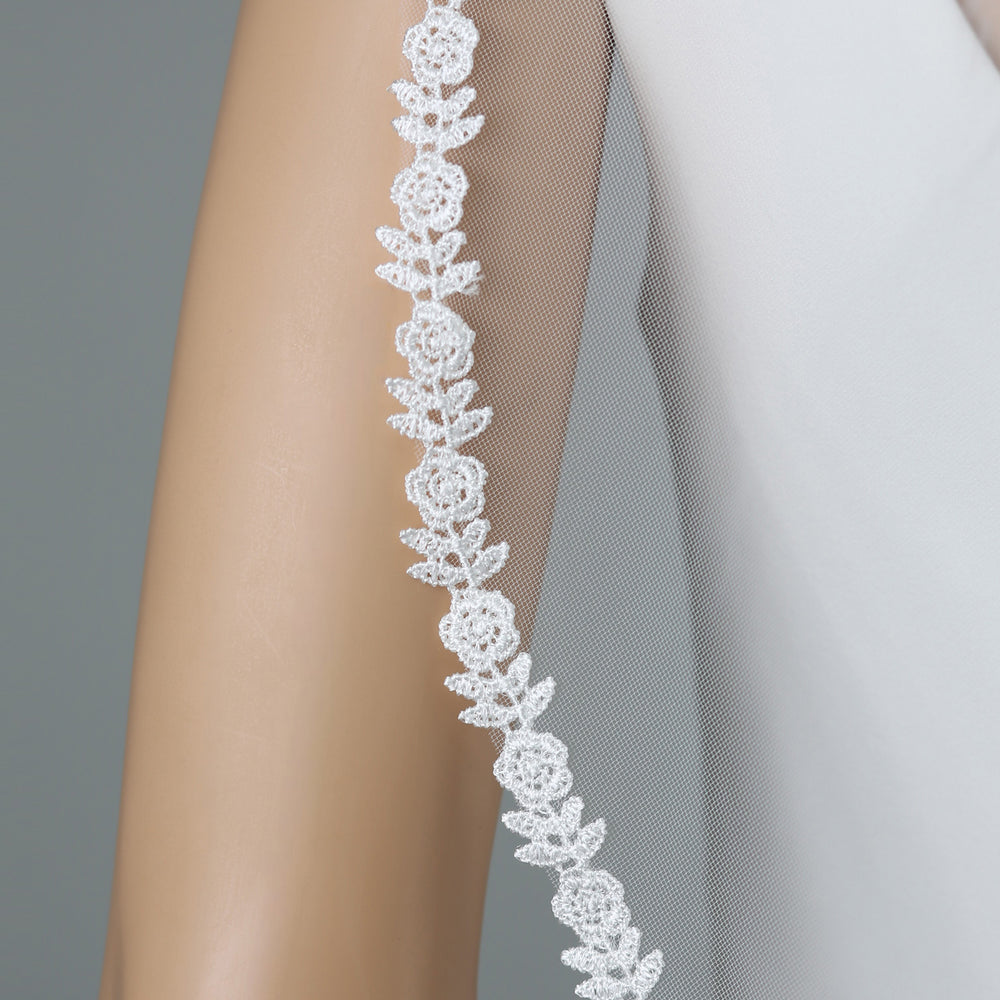 Close-up of FS6318 floral lace embroidery with rhinestones and pearls.