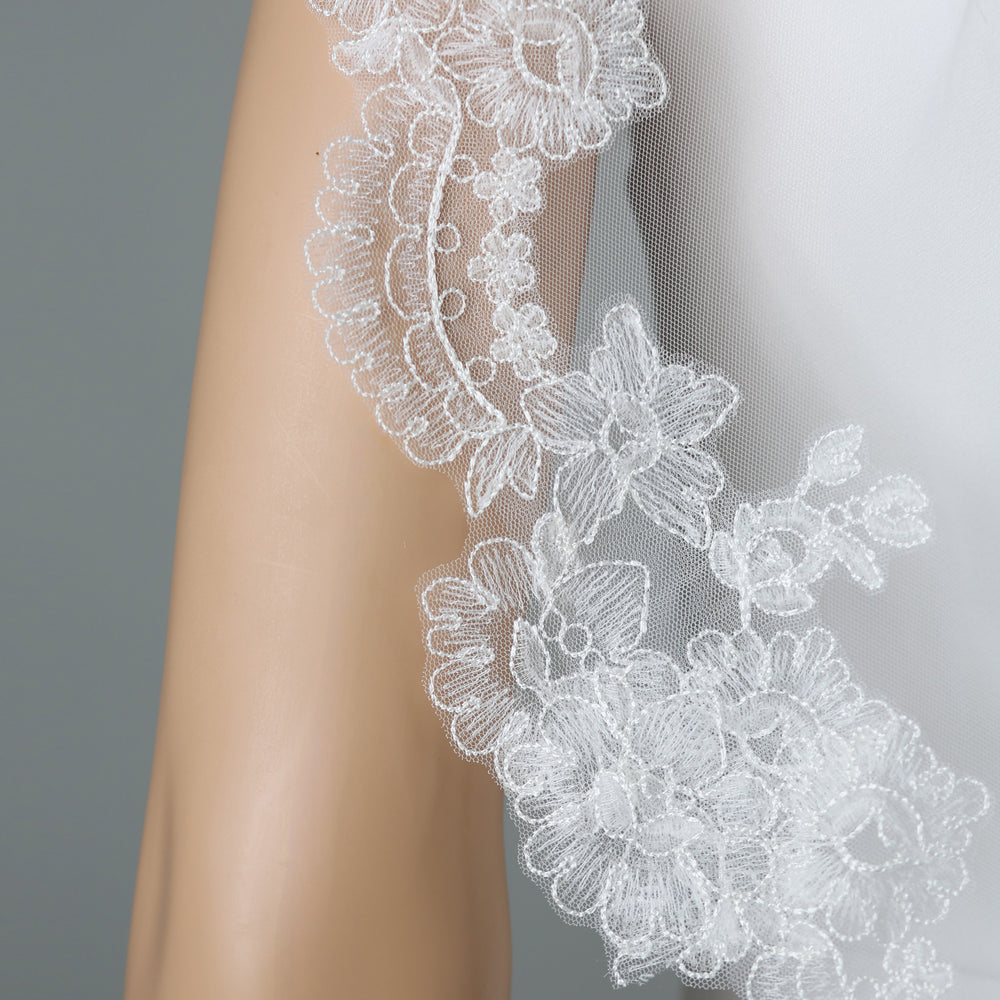 Close-up of FS6320-M floral lace embroidery with rhinestones and sequins.