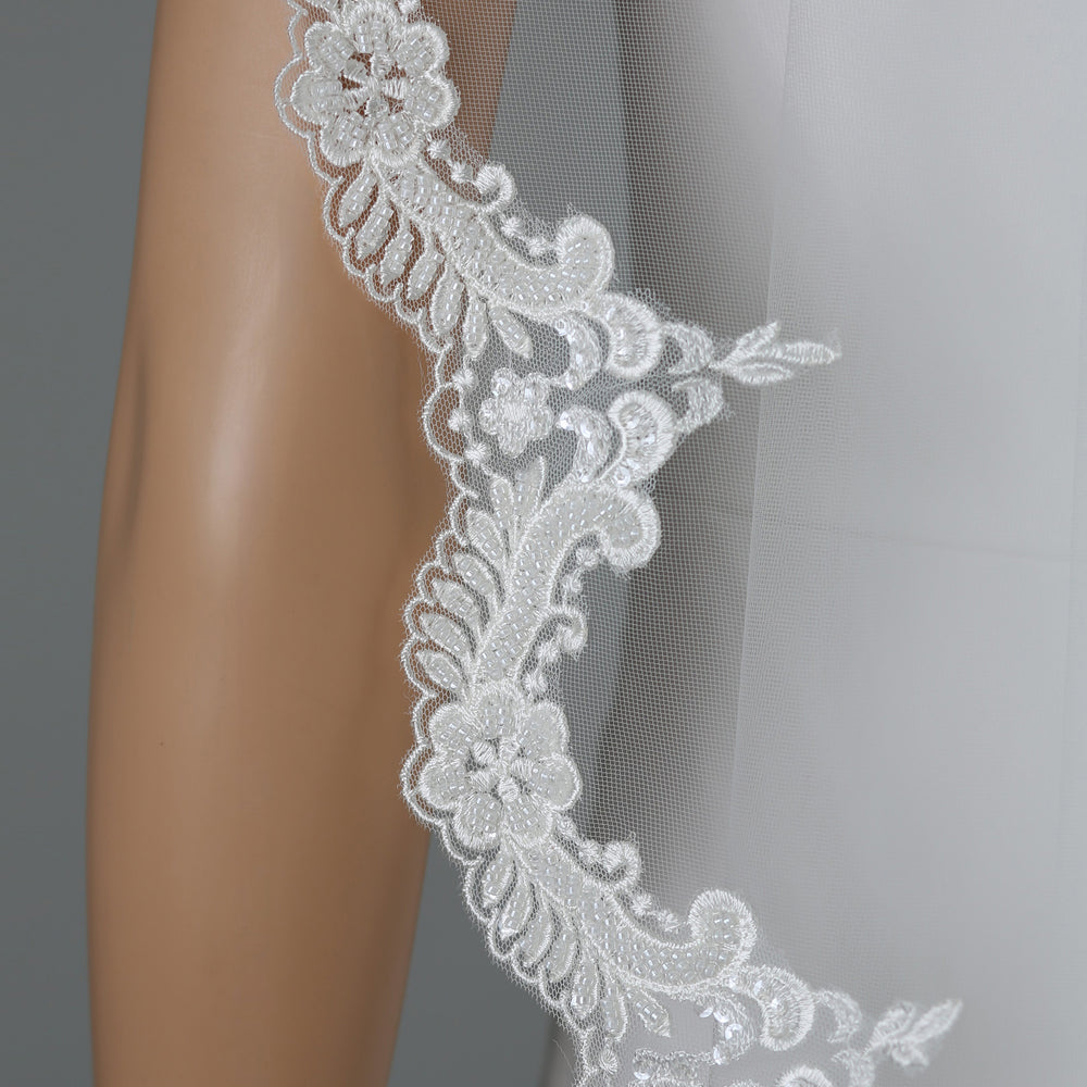 Close-up of FS6224 floral lace details with rhinestones and pearls.