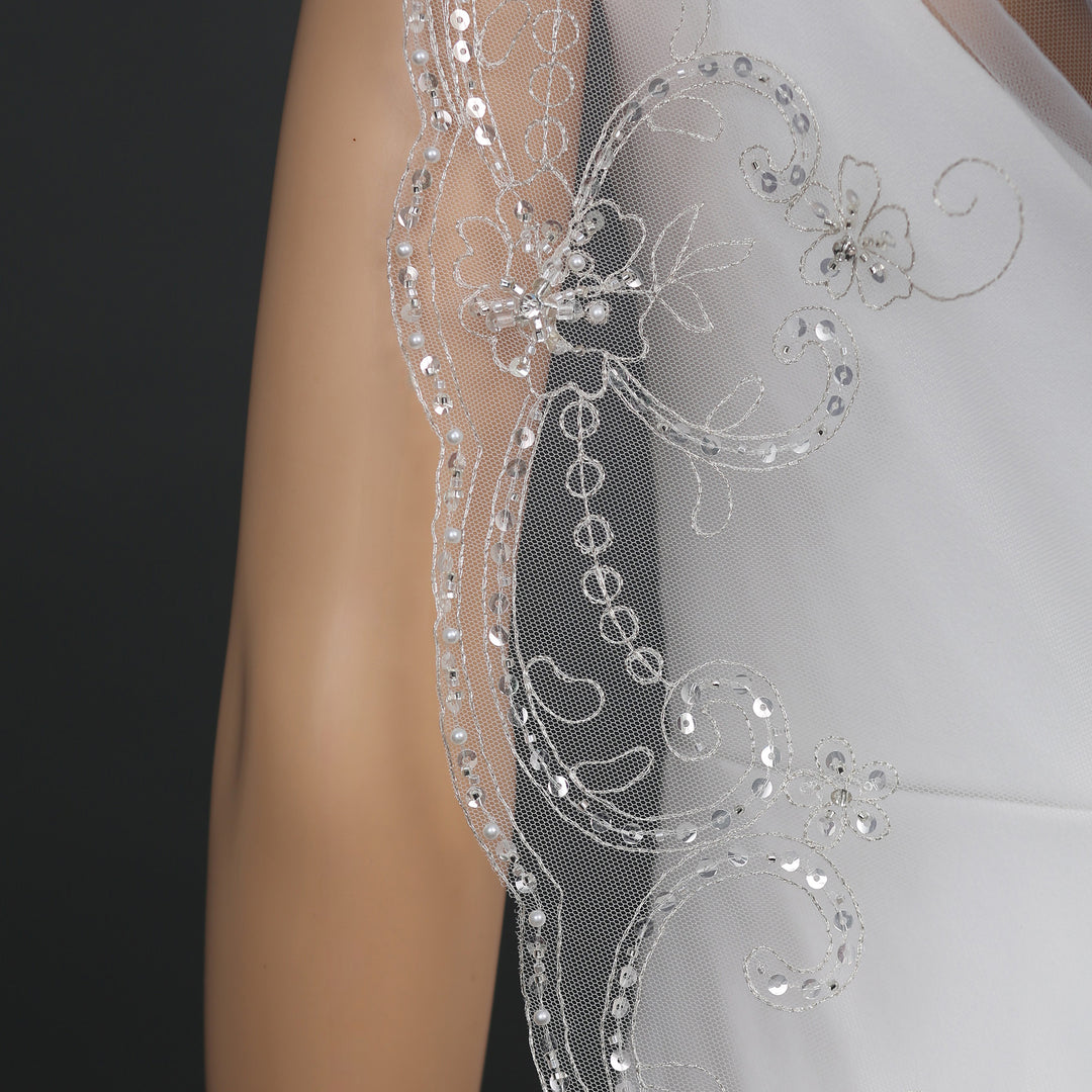 Close-up of FS6325 scalloped edges and floral embroidery.