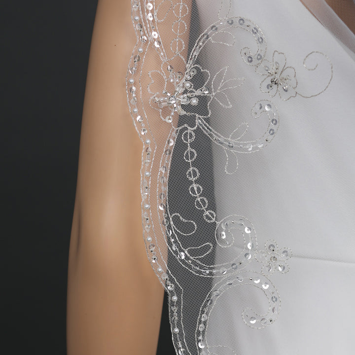 Close-up of FS6325 scalloped edges and floral embroidery.