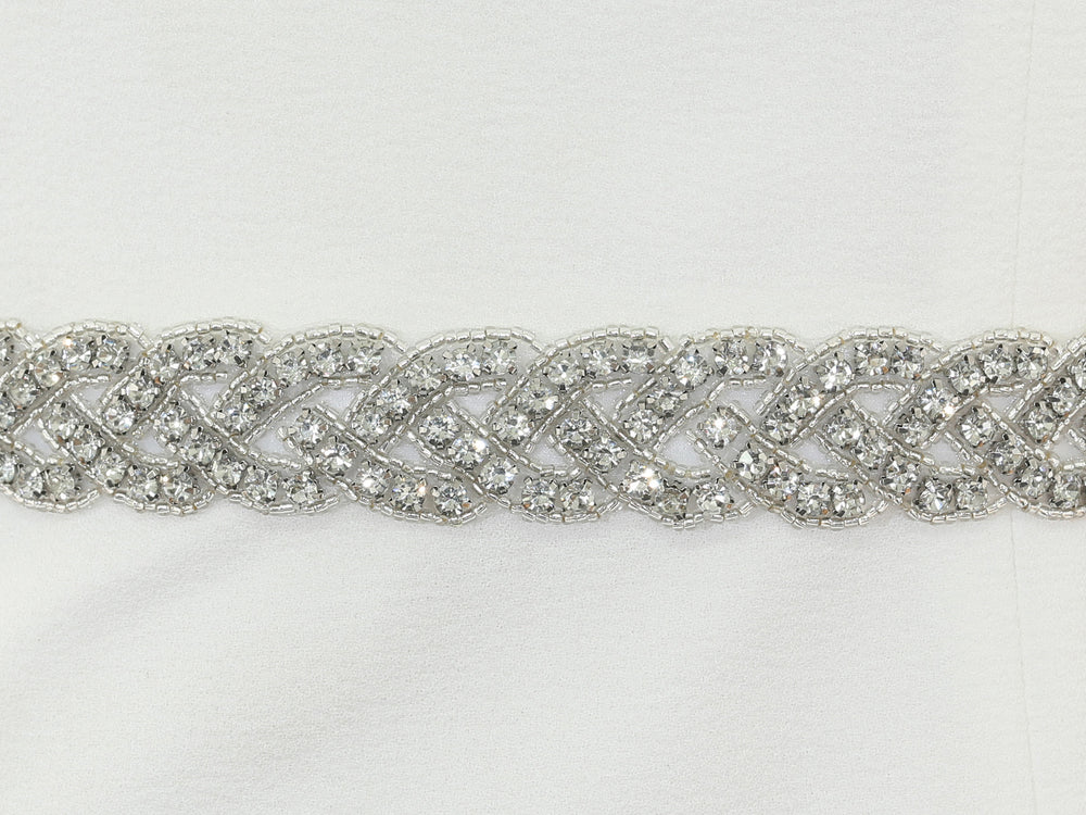 Close-up of S1013 floral embroidery with rhinestone accents.